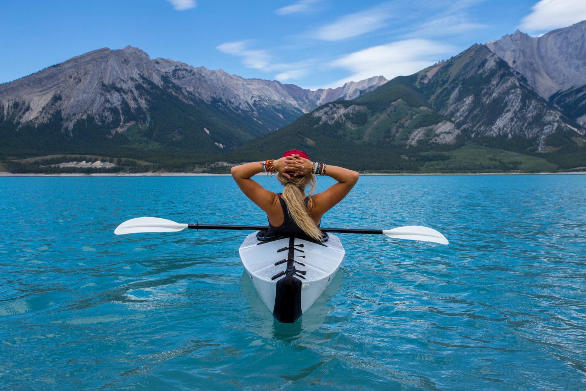lady on a kayak in the ocean